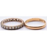 A 22ct gold wedding band/ ring (1.8g, size M) and a 9ct gold eternity ring set with paste (1.8g,