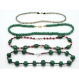 An emerald and jade necklace, quartz and garnet necklace, labradorite necklace, and a quartz