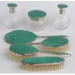 Art Deco green guilloché enamel and hallmarked silver mounted dressing table set, comprising three
