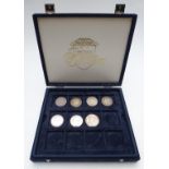 Westminster coin collection case containing seven coins comprising three George III crowns, two
