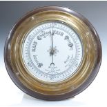 Mid 20thC brass cased aneroid barometer in mahogany surround, 'British Made' to 16cm dial