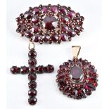 Two Victorian pendants and a brooch set with Bohemian cut garnets, 2 x 3.5cm