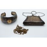 A hallmarked silver purse and a silver and 18ct gold bangle