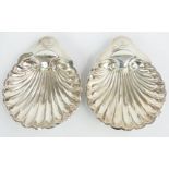 Pair of Victorian hallmarked silver shell shaped dishes raised on three ball feet, Sheffield 1899