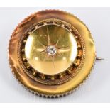 Edwardian 15ct gold brooch set with an old cut diamond, verso a glass compartment, maker's mark WGM,