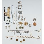 A collection of jewellery including a silver and moonstone ring, a silver necklace, silver