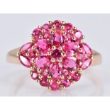 A 9ct gold ring set with pink sapphires in a cluster, 3.3g, size O