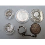 Four various silver coins to include USA 1883 Morgan dollar, Turks and Caicos Islands Olympic 20