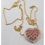 A 9ct gold heart pendant set with rubies and diamonds, on 9ct gold chain, 4.3g