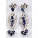 A pair of early 20thC platinum earrings set with round cut sapphires and old cut diamonds, 0.5 x 3.