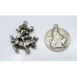 A silver St Christopher marked Huguenin and a white metal charm depicting a donkey, dog, kangaroo