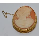 A 9ct gold brooch set with a cameo with rope twist border, 3 x 4cm