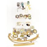 A collection of costume jewellery including two white metal brooches, a two strand pearl necklace,