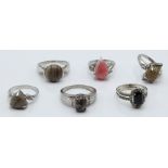 Six silver rings set with flint & white sapphire, rhodochrosite & zircon, flint & diamond,