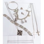 A silver charm bracelet, filigree bracelet, silver bangle, silver chains and pendants, enamel
