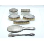 Art Nouveau hallmarked silver hand mirror, three silver backed brushes, silver handled shoe horn and