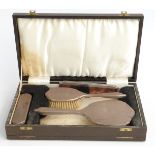 Hallmarked silver mounted dressing table set, comprising hand mirror, two brushes and comb,