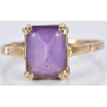A 9ct gold ring set with an emerald cut amethyst, 2.4g, size N