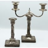 Pair of Victorian hallmarked silver candlesticks with wrythen column stems and embossed