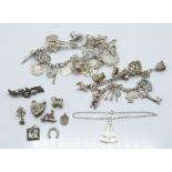 Two silver charm bracelets, brooch etc (116g)