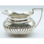 Edward VII hallmarked silver milk jug with reeded lower body, Sheffield 1902 maker Cooper Brothers &