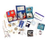 A collection of jewellery including ceramic cameo, belt buckles, silver pendants, silver chains,