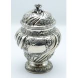 Edward VII hallmarked silver covered pedestal tea caddy with wrythen moulded and repoussé floral