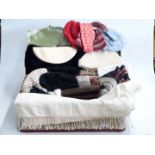 Mixed textiles in vintage suitcase including furs, crocodile skin handbag, hats, linen, etc