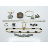 A collection of silver jewellery including Victorian brooches, rings, pot etc