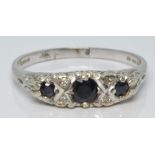 A 9ct white gold ring set with diamonds and sapphires, 3.2g, size T/U
