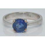 An 18ct white gold ring set with a round cut Sri Lankan sapphire of approximately 0.85ct, 3.0g, size
