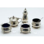 Hallmarked silver three piece cruet set with blue glass liners, Birmingham 1956 maker F C Richards