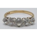A 9ct gold ring set with five white sapphires in vintage box, size R