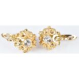 A pair of 18ct gold earrings set with paste, 4.6g