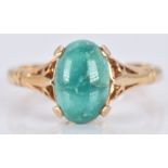 A 9ct gold ring set with a turquoise cabochon, 2.6g, size K