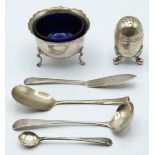 Hallmarked silver items including open salt with blue glass liner, Victorian pepper, Sheffield