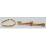 Victorian 22ct gold ring (1g)and a Victorian yellow metal T bar (1.2g)