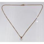 A 9ct gold necklace and pendant set with a single diamond of approximately 0.25ct, 3.6g