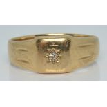 A 9ct gold ring set with a diamond in a star setting, 3.7g, size R/S