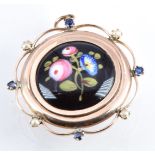 Victorian 9ct gold locket set with an enamel floral plaque with sapphires and seed pearls to the