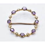A 15ct gold Edwardian brooch set with amethysts and seed pearls.