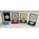 Four cased commemorative silver proof crowns comprising Royal Mint 1977 Silver Jubilee, 1980 Queen