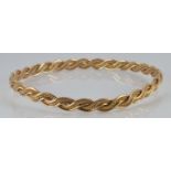 A 9ct gold plaited bangle, 10.4g