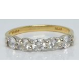 An 18ct gold ring set with five diamonds each approximately 0.15ct, 2.5g, size K/L