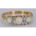 An 18ct gold ring set with opals and diamonds, 3.5g, size R