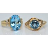 Two gold rings set with blue topaz, 9.3g, size N and O