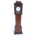 A 19thC watch holder in the form of a longcase clock