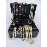 A collection of necklaces including pearls, amethyst etc, in Asprey jewellery box