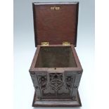 Victorian oak tea caddy or similar, with carved floral and Gothic decoration, raised on bun feet, 25