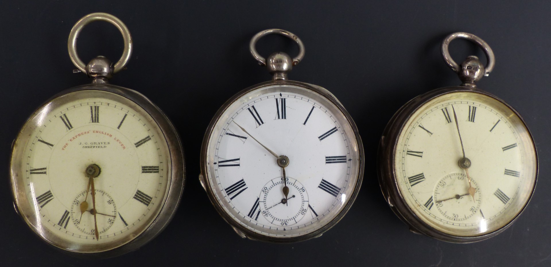Three hallmarked silver open faced pocket watches all with subsidiary seconds dials, gold hands,